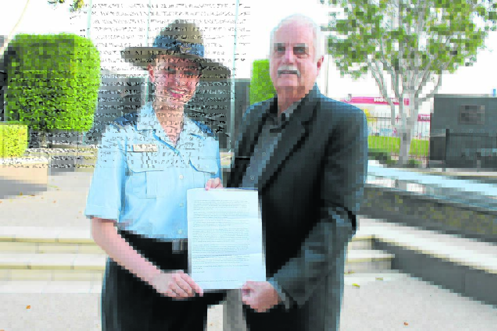 Australian Air Force Cadet Katelyn Zoethout, pictured with Greenbank RSL sub-branch secretary Howard Buckley, will travel to Canberra for the Anzac Centenary celebrations next year after winning an Anzac Day speech writing competition.