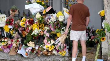 Flowers are being left in tribute to Jesse Baird and Luke Davies at the former's Paddington home. (Bianca De Marchi/AAP PHOTOS)