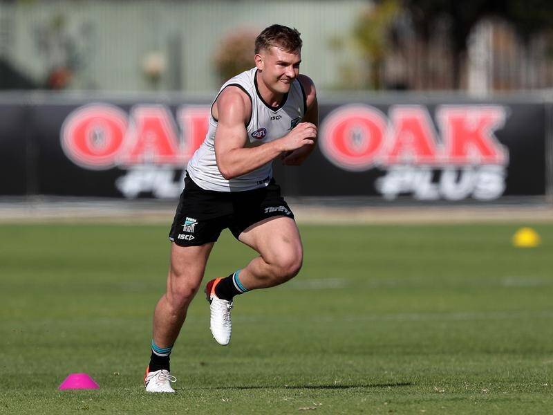 Ollie Wines is poised to return to Port Adelaide's AFL line-up for the clash with leaders Geelong.