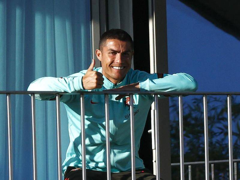 Cristiano Ronaldo in cheery mood at the Portugal camp before his return to Italy.