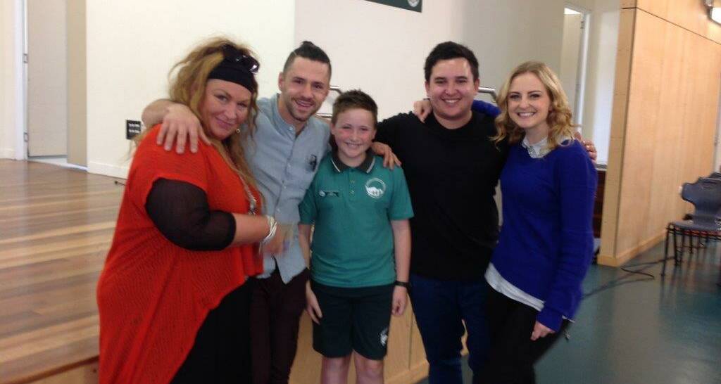 The Voice's top four Team Ricky contestants, Gail Page, Scott Newnham, Liam Maihi and Naomi Price with Greenbank State School captain Izak Jamieson.
