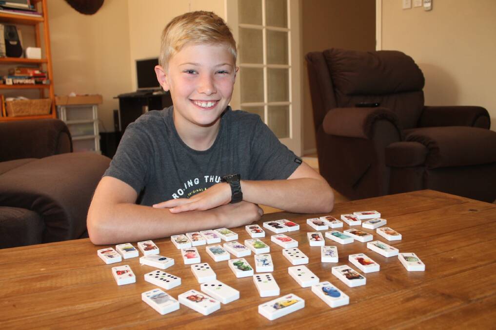 Flagstone boy Matthew Bristol is calling on the community to donate their spare Woolworths dominoes to a burns victim in Vietnam.