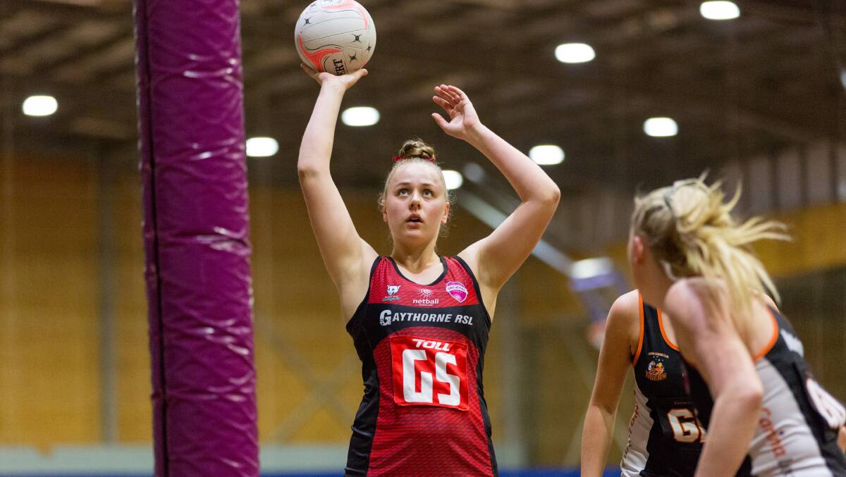 Riley Holland from Brisbane North Cougars shoots for goal against Carina Leagues Club Tigers, QSNL Division 1, Round 15, August 28. Photo: Netball Queensland