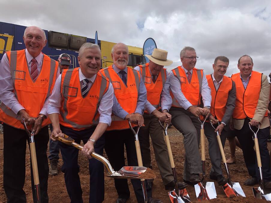 NO TURNING BACK: Deputy Prime Minister Michael McCormack uses the commemorative shovel at a sod turning ceremony to launch Inland Rail’s construction at Parkes in NSW. 