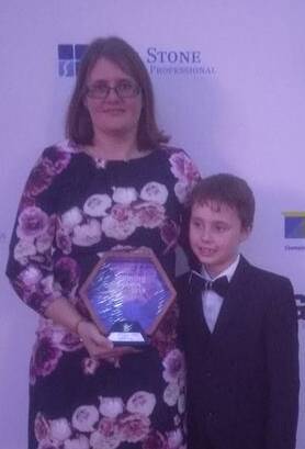 WIN: Fi Roebig and son Thom at South East Queensland Training Awards, Dreamworld on Friday. Photo: Supplied
