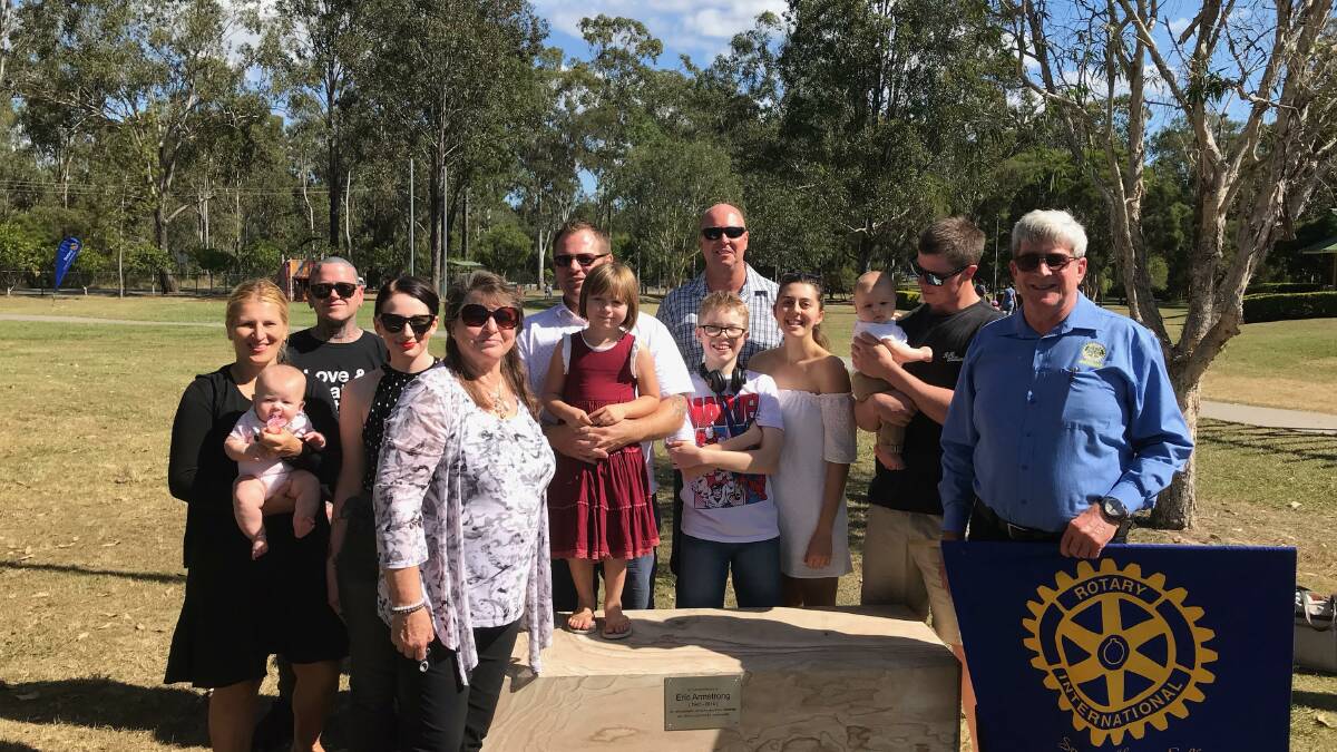TRIBUTE: Wife Anne and the children and grandchildren of Eric Armstrong with Rotary Jimboomba president Ray McCabbin. Photo: Supplied