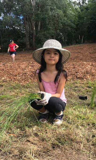 Residents and wildlife groups gathered to plant 1600 trees as part of Earth Day celebrations. Photos: Supplied