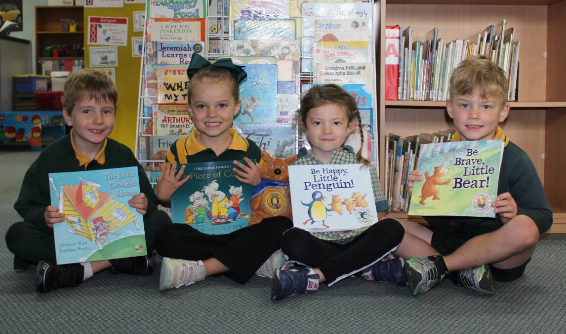 READERS: Jimboomba State School beneficiaries of the QuoCKa reading program include Kaiden Benn, Scarlett Bates, Mali Ling and Kayde Adams. Photo: Lisa Simmons