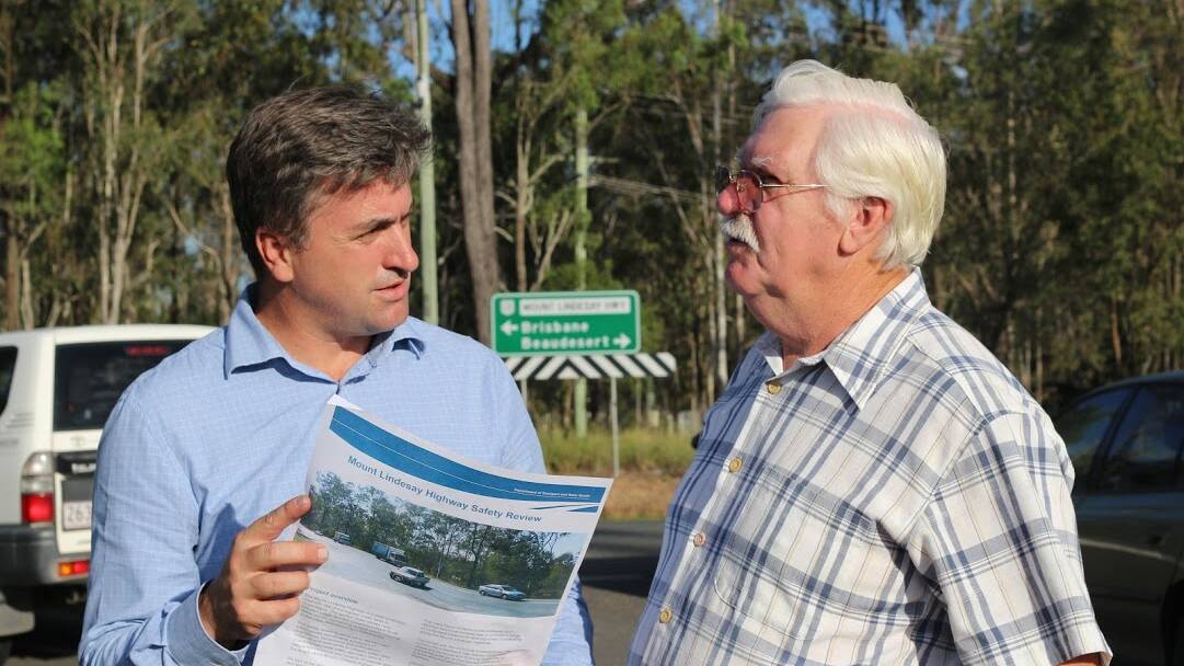 Logan MP Linus Power and Flagstone resident Terry McLaughlin discuss issues with the Mount Lindesay Highway
