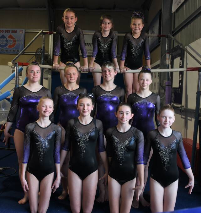 Contingent: Eleven of the 12 Jimboomba Gymnastics Club's team who are competing at the state titles on the Gold Coast. They have qualified despite battling lockdowns and breaks in community sport.