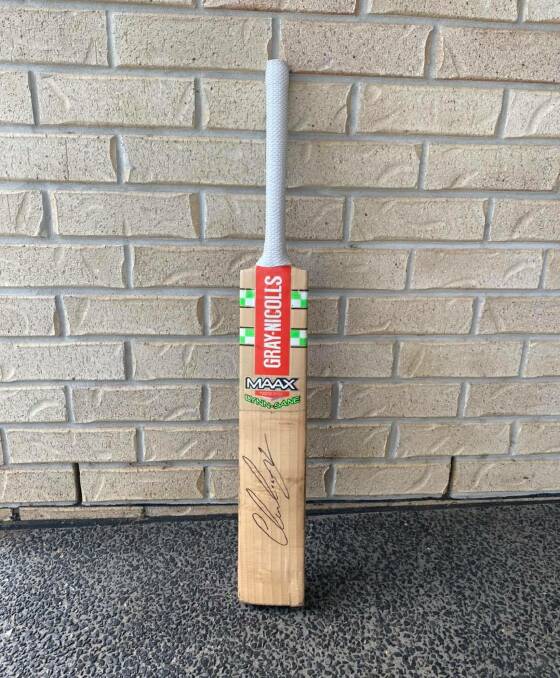 RARE: A signed Chris Lynn bat is up for auction to raise money for the Black Dog Institute.