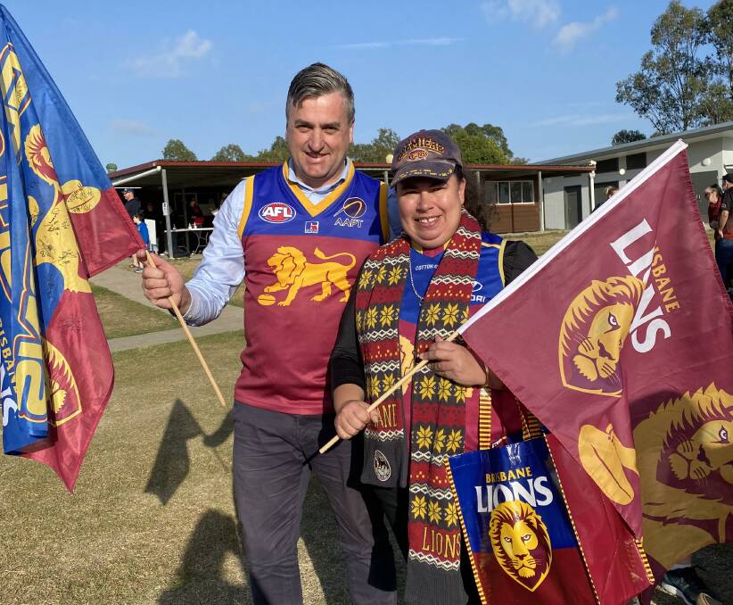 Flying the flags: Logan MP Linus Power and long-time Lions supporter and Jimboomba Redbacks stalwart Aurora Hodges.