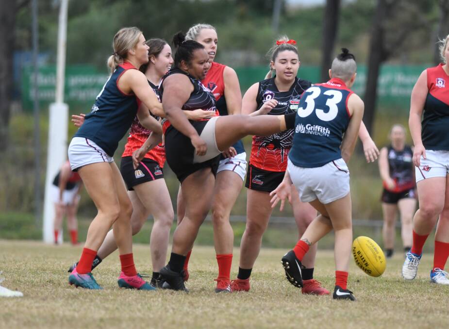 TRAFFIC: Simone Saylor in action for Jimboomba Redbacks at Glenlogan Park earlier this season. The Redbacks lost to Beenleigh Buffaloes by a single point on the weekend.