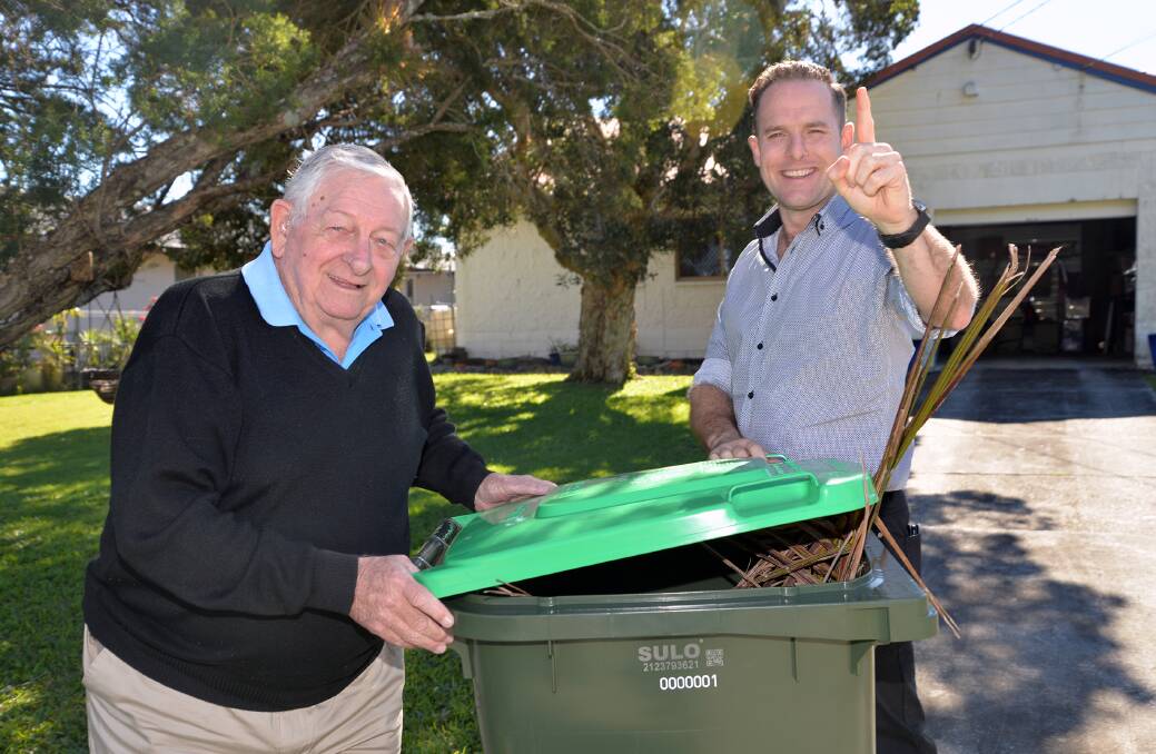 DELIVERY: Waterford West man Norman Chant with Logan City Council deputy mayor Jon Raven and Mr Chant's new green bin. 