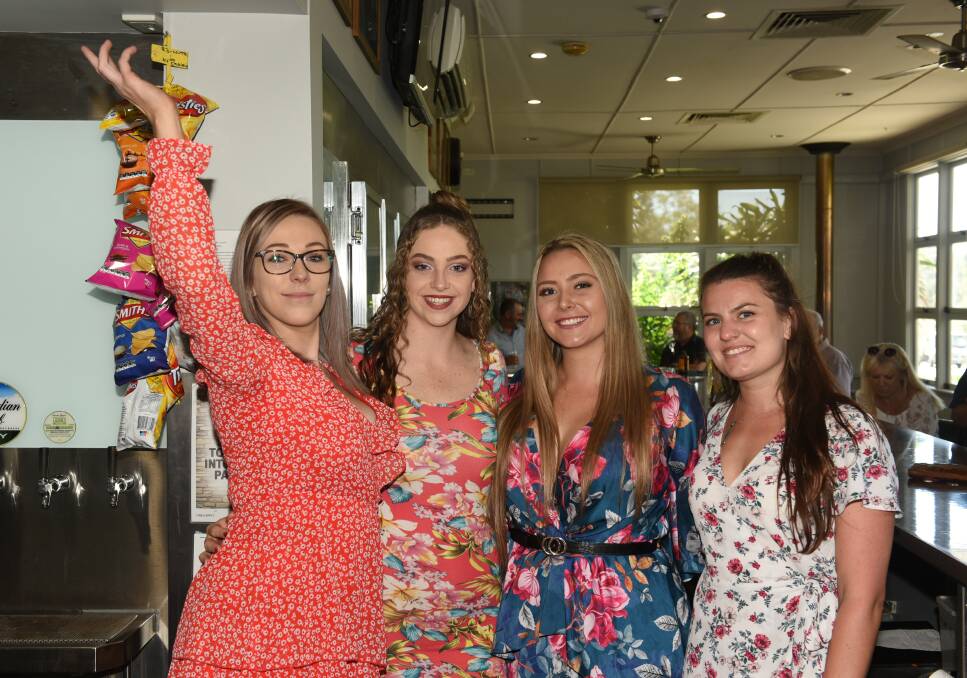 Belles behind the bar: Demi Currie, Elkie Munn, Jasmine Mills and Georgina Pratt at the V Hotel on Melbourne Cup day.