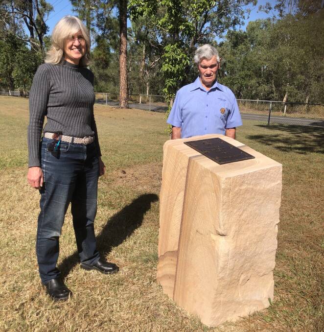 In memory: Nadia O'Carroll and Paul Krahnen with the new Tamborine Village Lions Club memorial for animals who died in war.