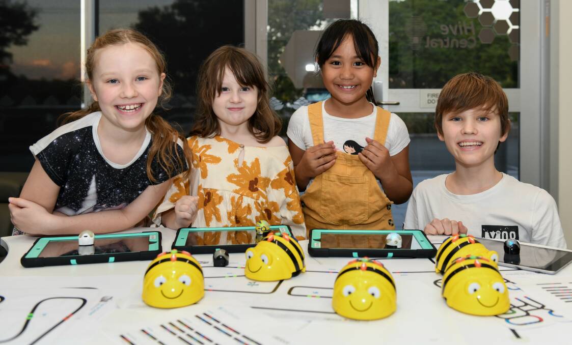 Tech-savvy: Amica Rottmann, Jeannie Hall, Tanya Leti and Karl Rottmann are looking forward to borrowing robots from their library for the school holidays.
