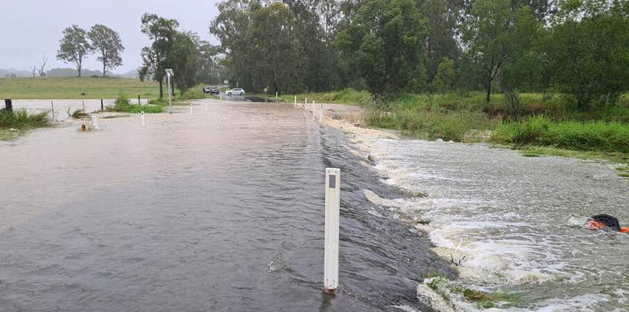 COVERED: Mundoolun Road was underwater this morning.