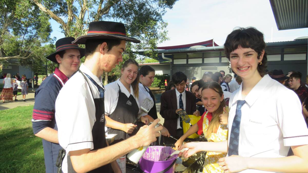 Pancakes for a good cause: Year 12 community captain Emeleen Gillis with students on Shrove Tuesday.