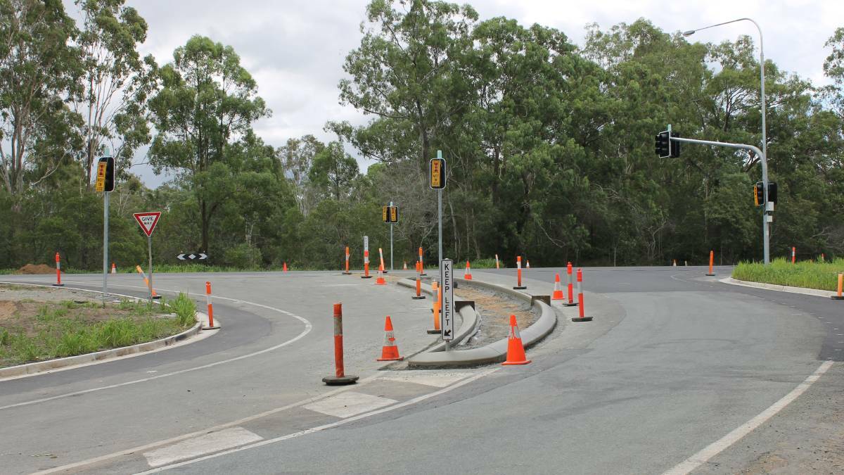 SMASH: An accident at the Millstream Road/Mount Lindesay Highway intersection left one driver in hospital. This picture shows the junction before traffic lights were installed.