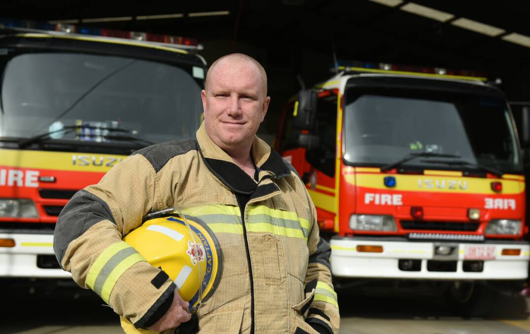Be alert to fire danger: Jimboomba's fire captain, Jason Hall, urges residents to be careful as the threat climbs. Photo: Matt McLennan