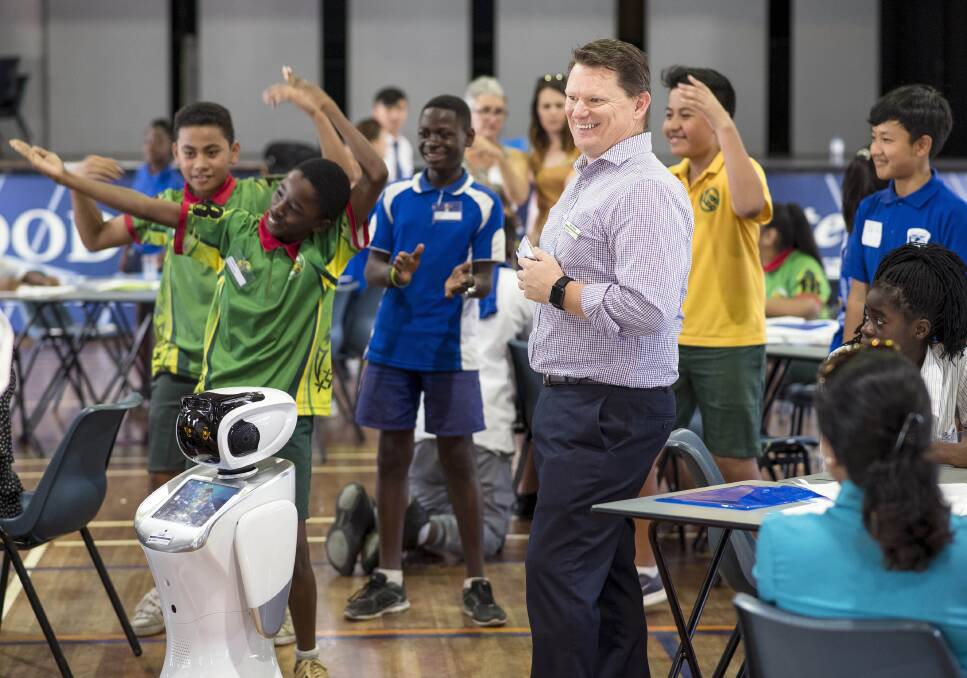 Shaping young minds: Council conducts a youth engagement session with high school students with the help of community engagement robot COLBIE.