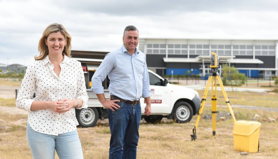 Surveying: Shannon Fentiman and Linus Power at the new Yarrabilba TAFE site.