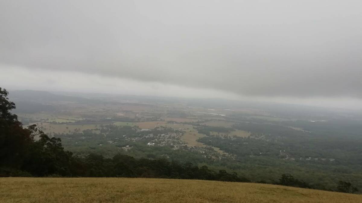Down: Temperatures will drop this weekend as south-east Queenslanders shiver. This misty view was taken from the top of Tamborine Mountain yesterday. 