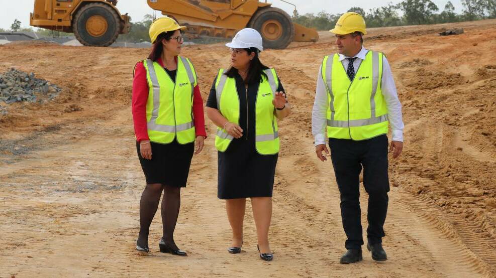 Early stages: Belinda Tregea with education minister Grace Grace and Logan MP Linus Power during construction of the Yarrabilba State Secondary College.