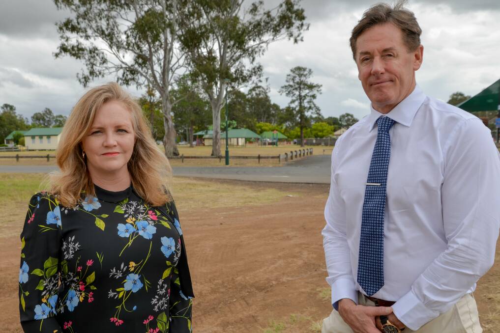 Not happy: Laurie Koranski and Darren Power at Logan Village's proposed McDonald's site which has angered locals. Council says its hands are tied as it comes under state legislation.