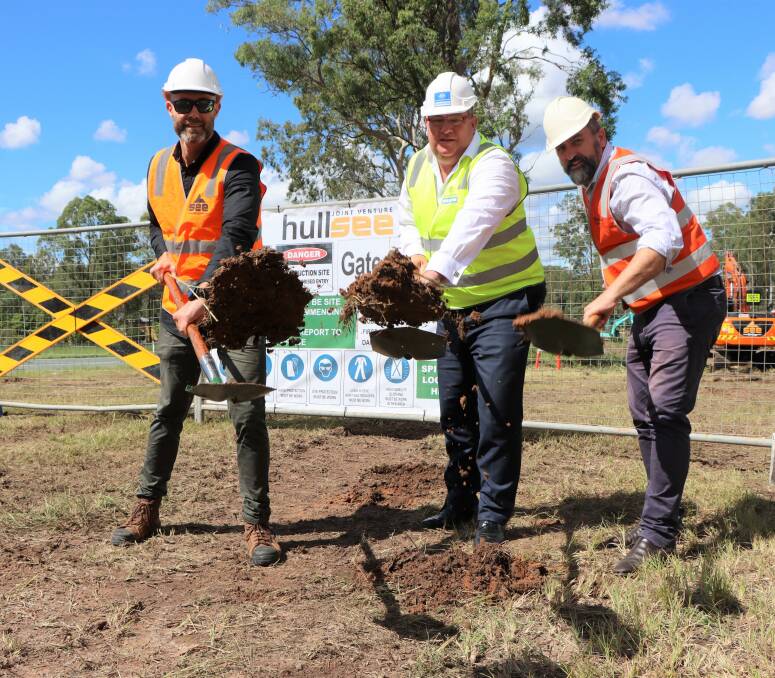 SHOVELS UP: HullSee JV's Finn Rowe, Wright MP Scott Buccholz and Logan MP Linus Power at the site of the latest Mount Lindesay Highway upgrade.