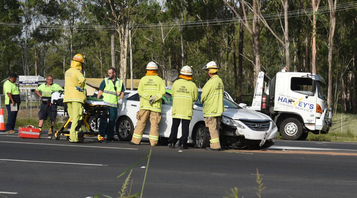 Accident: Emergency crews at the scene of Monday afternoon's crash. Photo: Matt McLennan