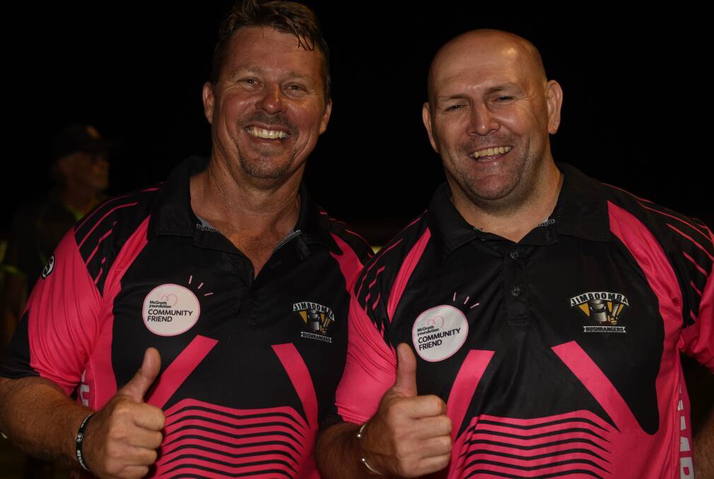 Big total: Scott Bannan and Brisbane Broncos legend Michael Hancock at the Pink Stumps fundraiser. 