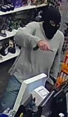 A man used a sharp implement during a Crestmead tobacco store robbery.