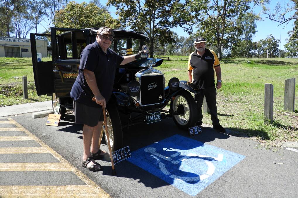 Classic machine: Cedar Vale Ford Model T owner Phillip Schultz with Jimboomba Heritage Vehicle Club president Peter Cotter.