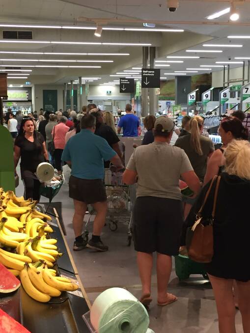 RESPONSE: Big crowds were at Jimboomba's supermarkets during the lockdown, but police have praised locals for their handling of the situation.