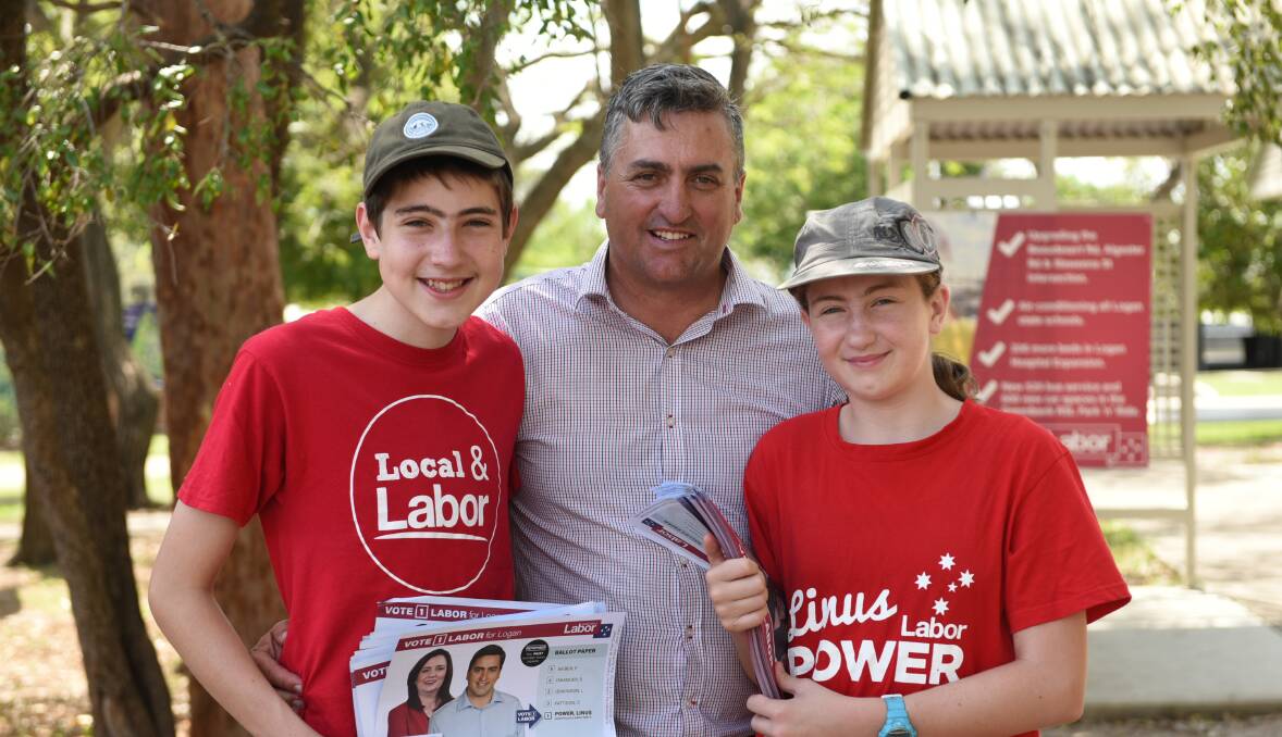 Family by his side: Logan MP Linus Power with son Jack and daughter Caitlin at Boronia Heights on Saturday before a hail storm hit the polling booth. Photo: Matt McLennan