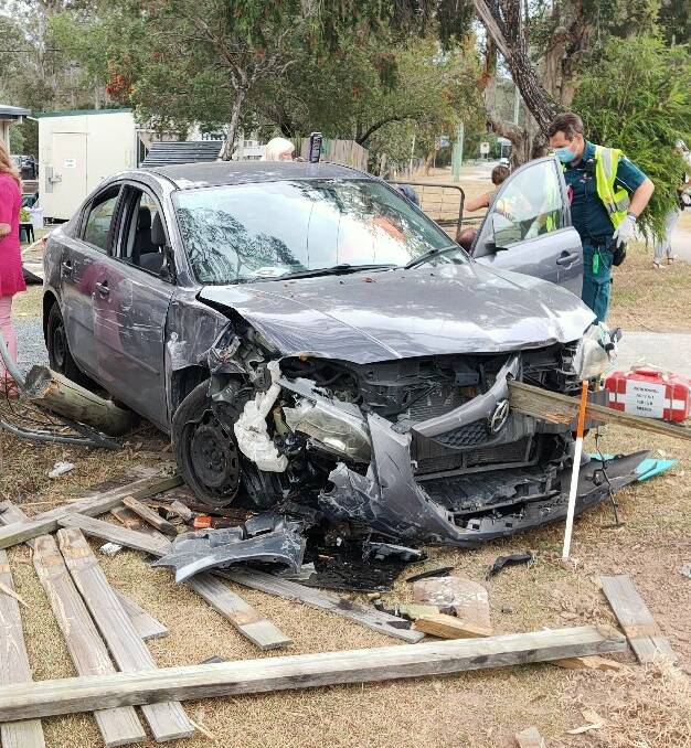 Crash: A car smashed through a fence at Jimboomba this afternoon.