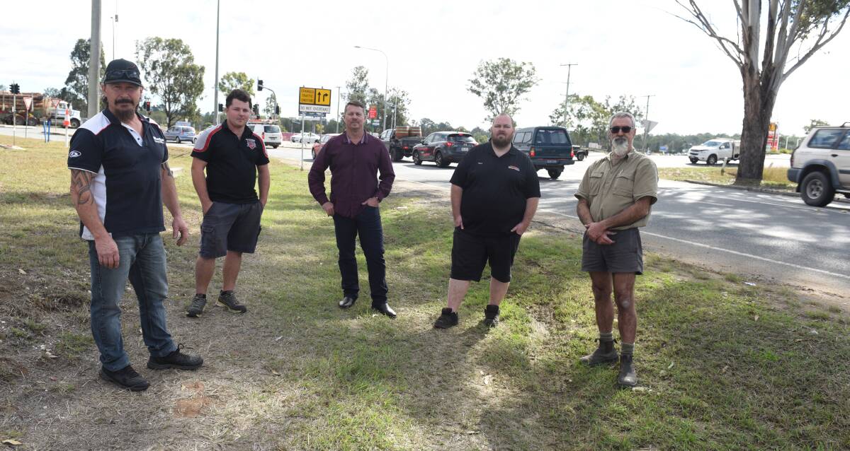 Business owners angry: Dave Mimicka (MX Imports), Terence Demar (Paul's Tyres), councillor Scott Bannan, Gary Harvey (Stihl Shop) and Glenn Stacey (Shady Characters) at the troublesome Tamborine Street intersection.