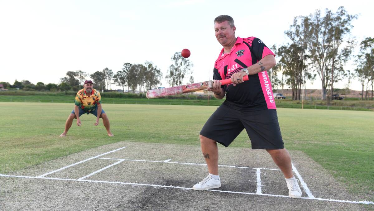 Eye in: Scott Bannan and Rodney Teese get some practice in ahead of Jimboomba's Pink Stumps Day in February. Photo: Matt McLennan