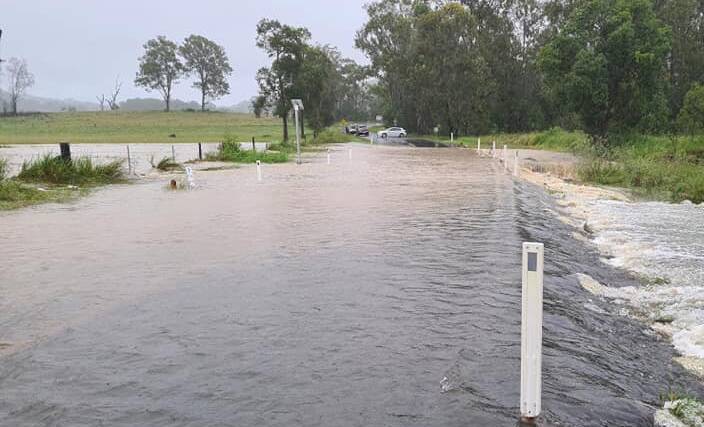 INUNDATED: Mundoolun Road was underwater this morning.