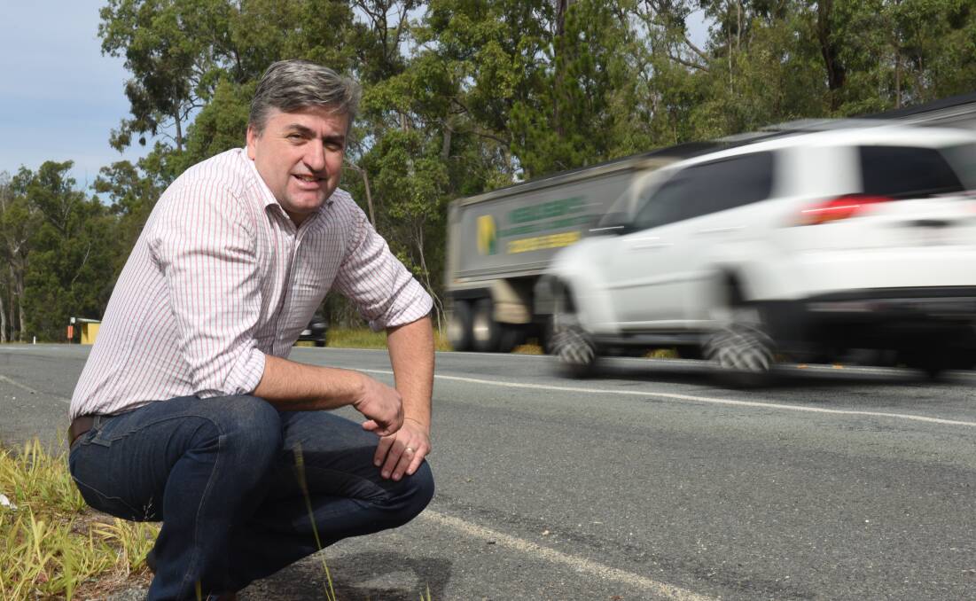 Motorists win: Logan MP Linus Power next to a dangerous stretch of the Mount Lindesay Highway which will be upgraded to four lanes.