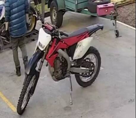 Hunting: Police are looking for a man who rides this distinctive motorbike, after it was used in a robbery this week.