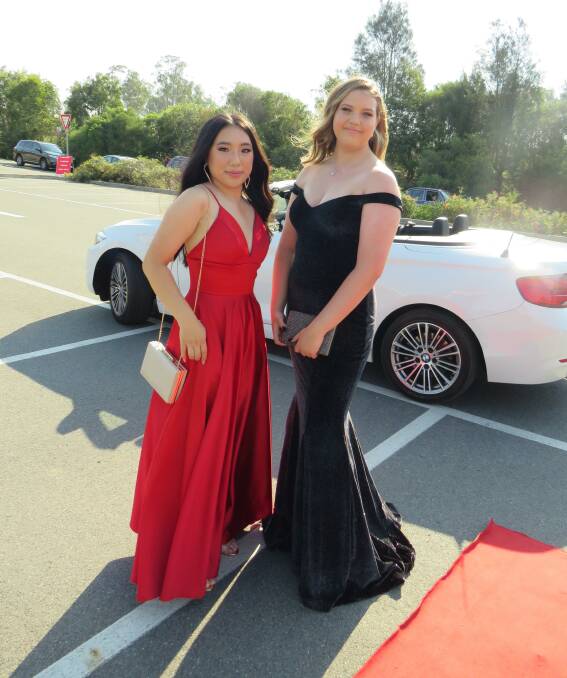 Looking good: Kyra Morrison and Catherine Nguyen at the Emmaus College formal. 