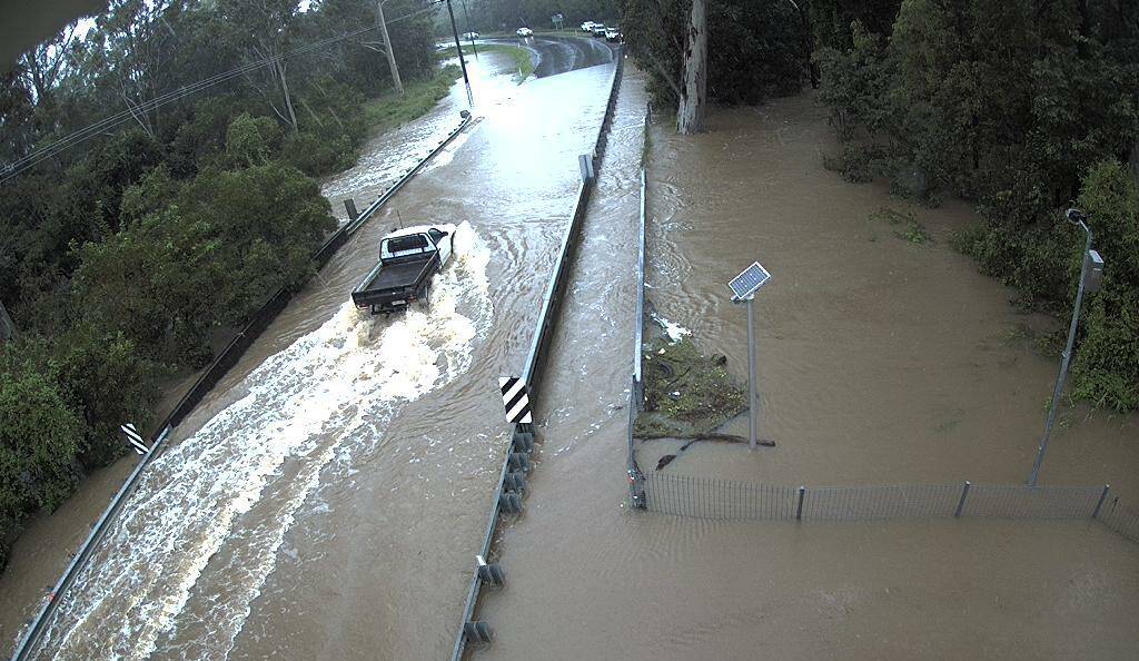 FLOODED: Water is over Jack Cusack Bridge at Cusack Lane.