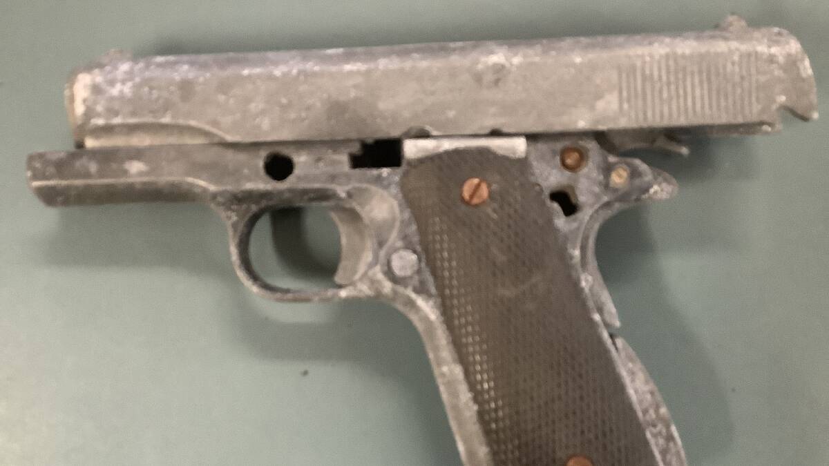 WEAPON: A US Army pistol found off Mundoolun Road by Logan City Council workers has police appealing for information on its owner.