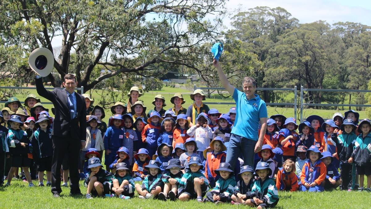 Downlands College deputy principal Tim Morrison and AgForce CEO, Michael Guerin, with children at the final Moo Baa Munch event in October 2018. Photo - Helen Walker.