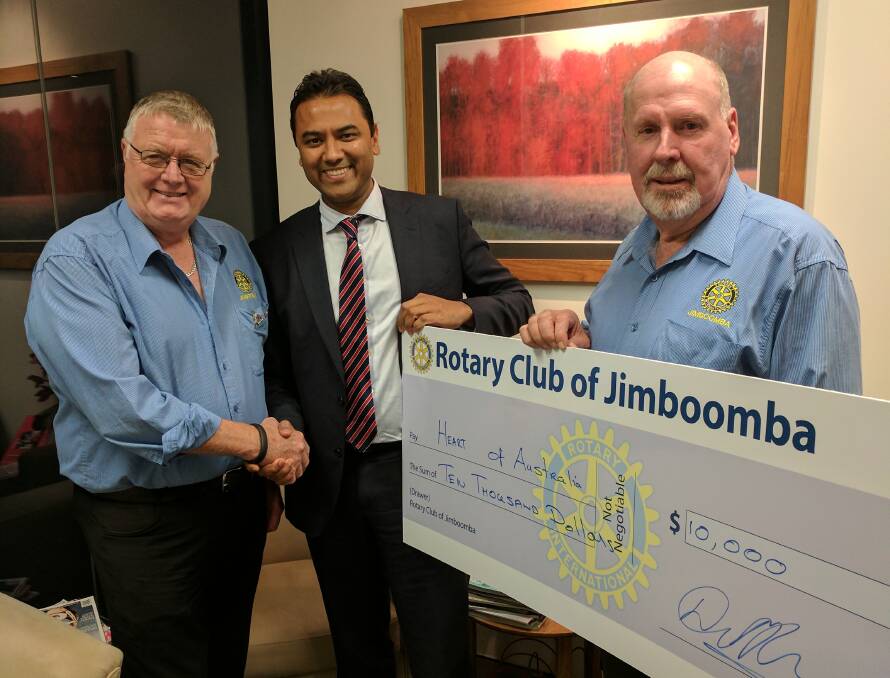 BIG CHEQUE: Jimboomba Rotary club president David Kenny, Dr Rolf Gomes of Hearts of Australia, and Rotarian John Weir. Photo: Supplied
