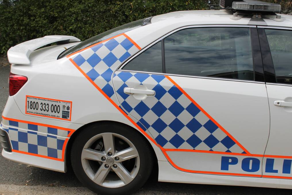 ROBBED: Police are searching for a white or cream Toyota Hilux. 