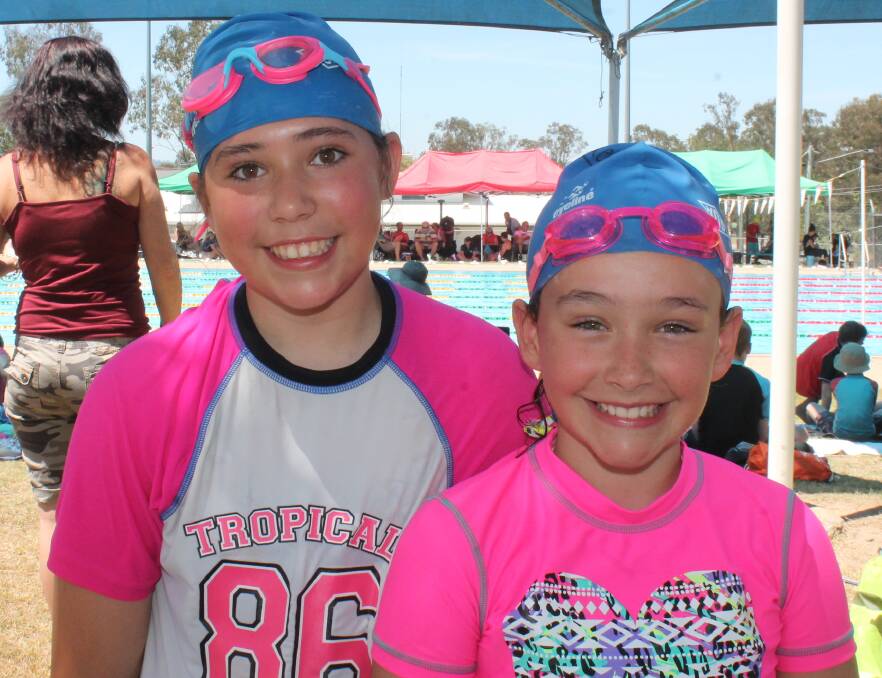 Sisters Britney, 12, and Kiara, 10, King were decked out in the pink and blue so they could be seen all the way across the pool.